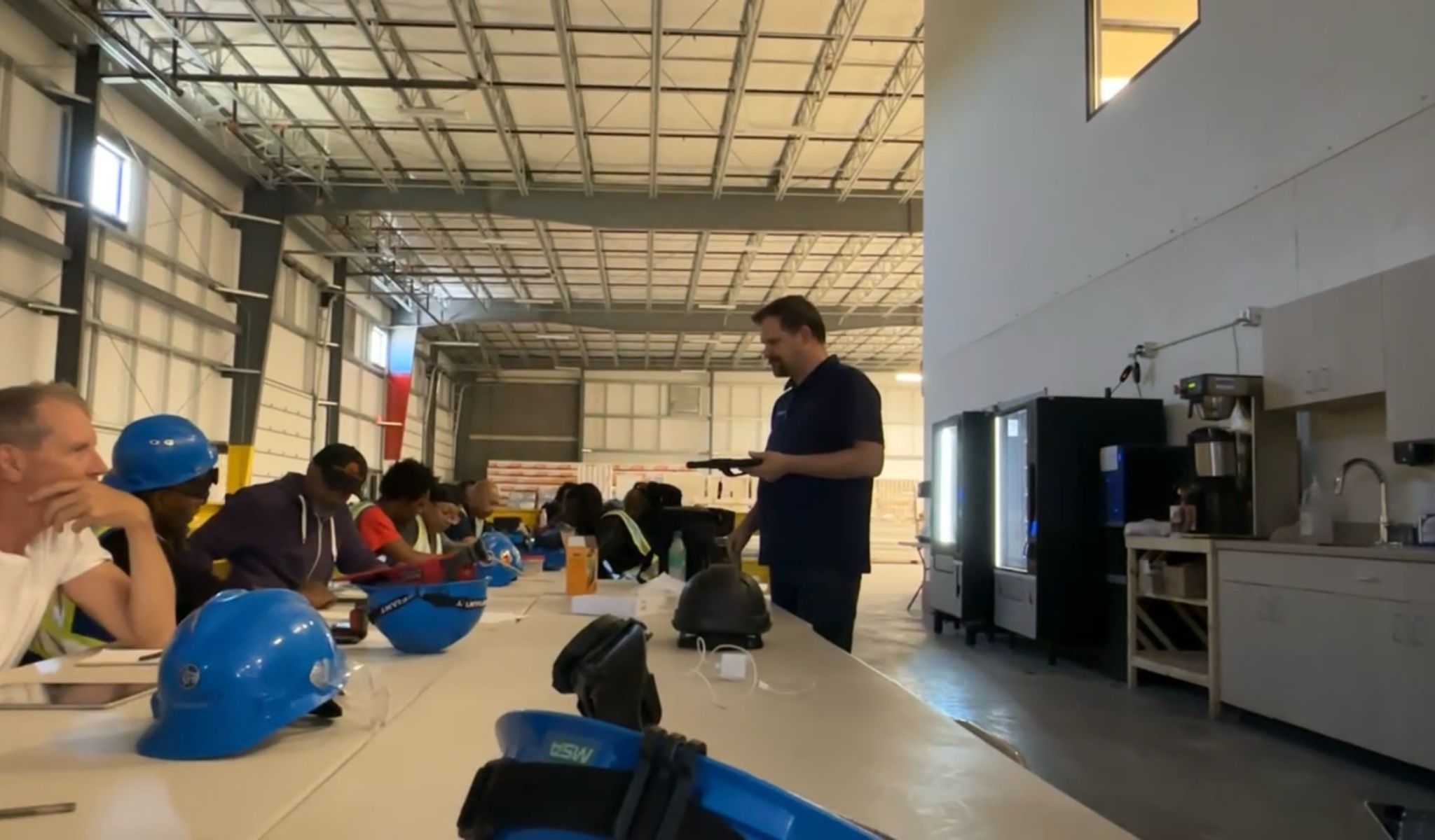 Jason Dixon training a production crew in a prefab factory classroom
